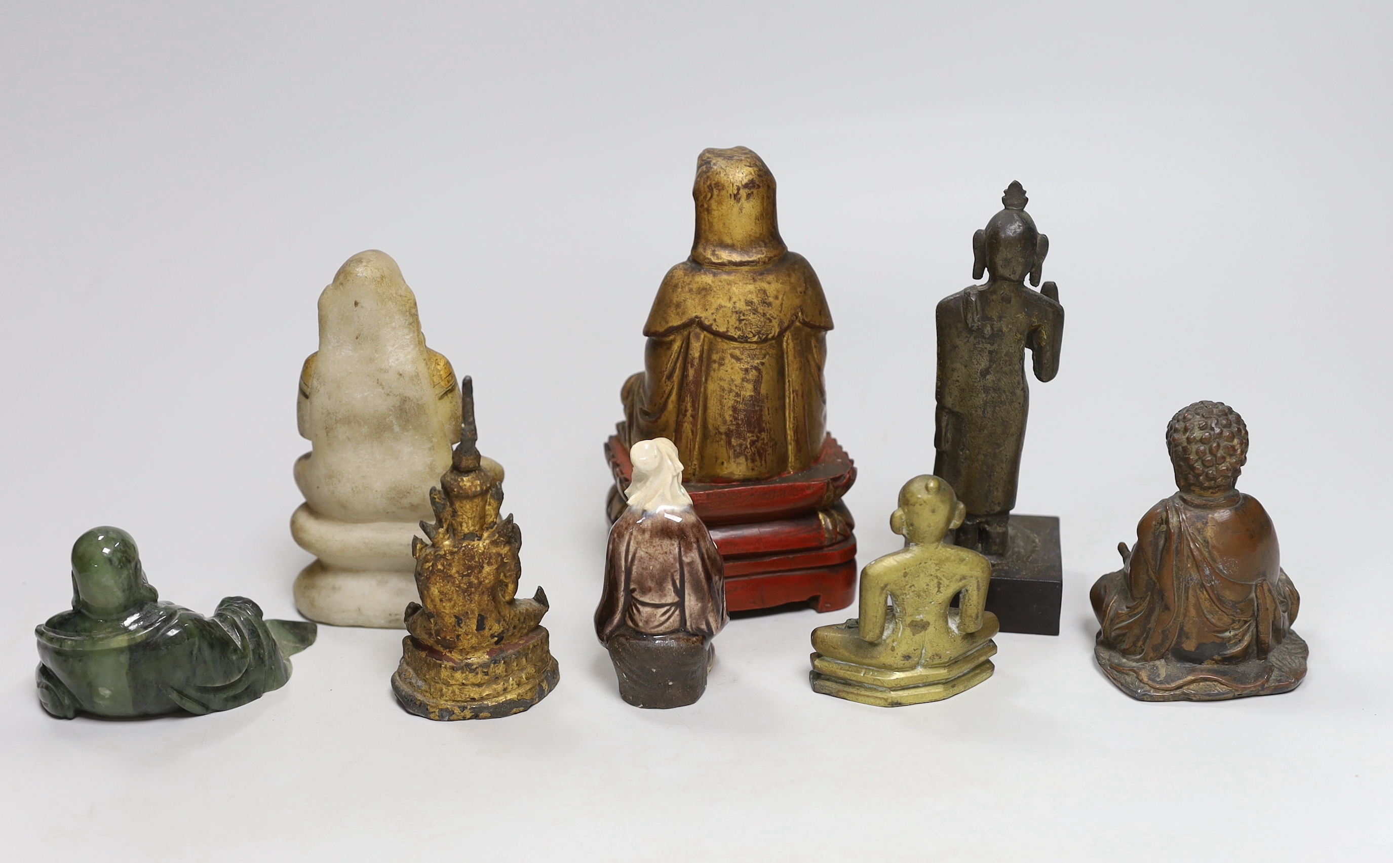 A group of Burmese, Chinese and Indian figures of deities, tallest 14.8cm (8)